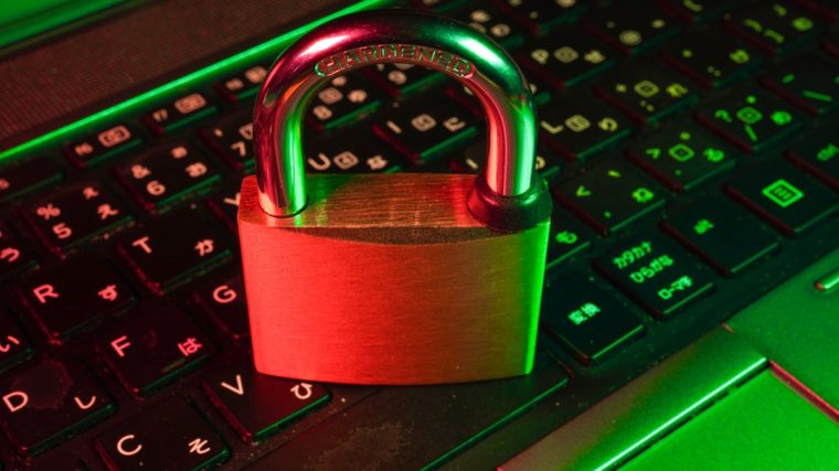 A padlock resting on a keyboard, symbolizing security.
