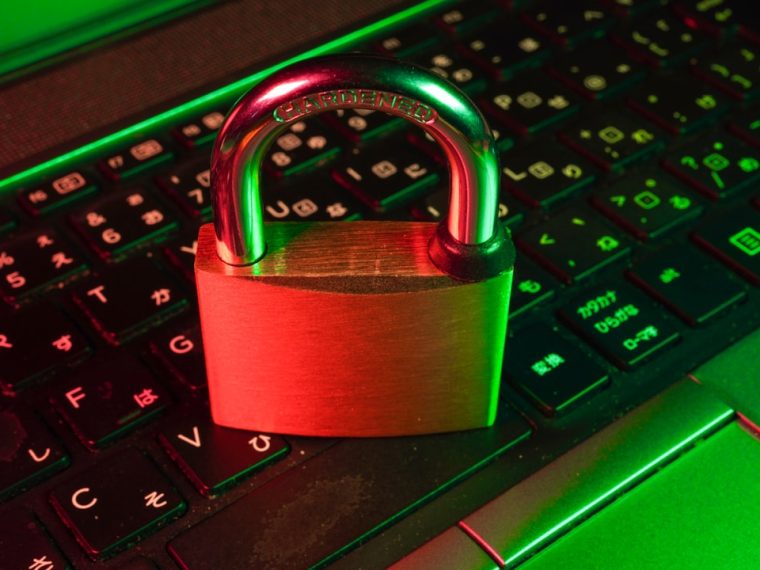 A padlock resting on a keyboard, symbolizing security.